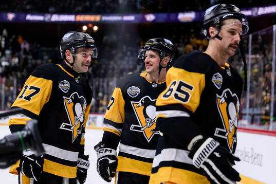 Bryan Rust, Sidney Crosby and Erik Karlsson of Pittsburgh