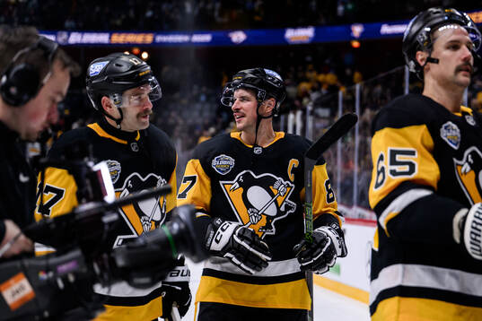 Bryan Rust, Sidney Crosby and Erik Karlsson of Pittsburgh