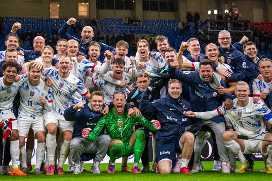 Players and staff of Norway celebrate
