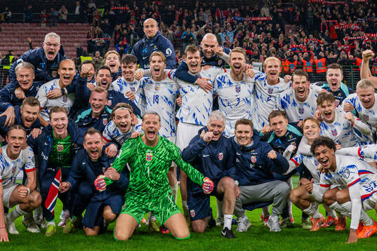 Players and staff of Norway celebrate