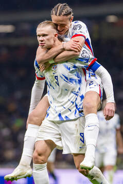 Erling Braut Haaland of Norway celebrates with teammate