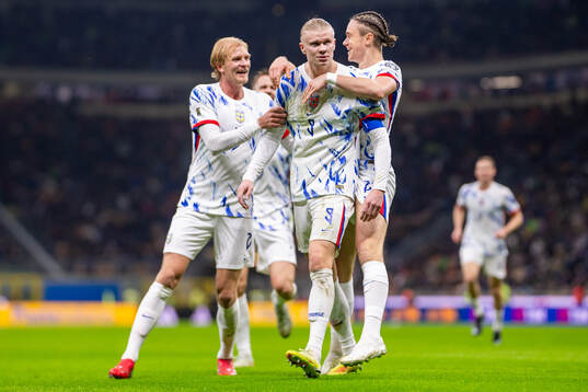 Erling Braut Haaland of Norway celebrates with teammates
