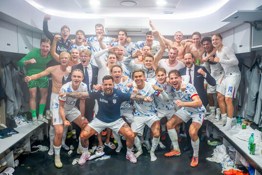 Players of Norway celebrate with Prince Sverre Magnus and