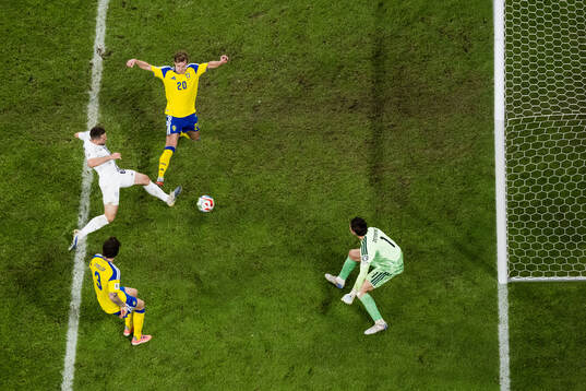 Timi Elsnik of Slovenia scores 0-1 behind Emil Krafth,