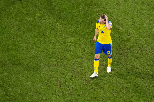 Carl Starfelt of Sweden looks dejected