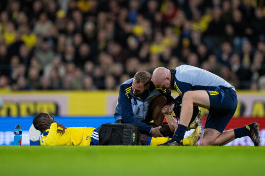 Ken Sema of Sweden receives medical attention