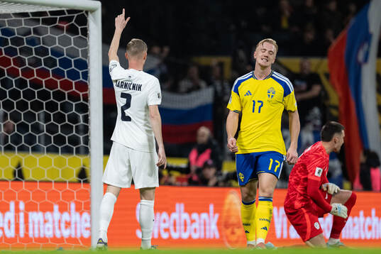 Gabriel Gudmundsson and Isac Lidberg of Sweden look dejected