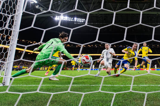 Timi Elsnik of Slovenia scores the 0-1 goal behind