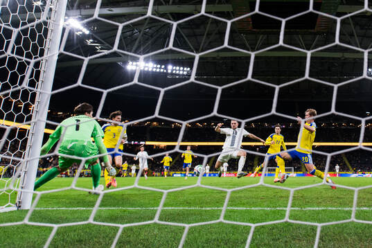 Timi Elsnik of Slovenia scores the 0-1 goal behind