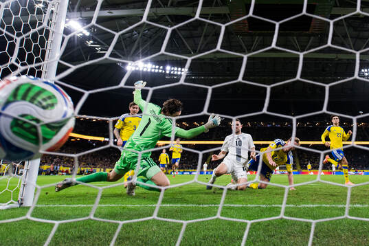 Timi Elsnik of Slovenia scores the 0-1 goal behind