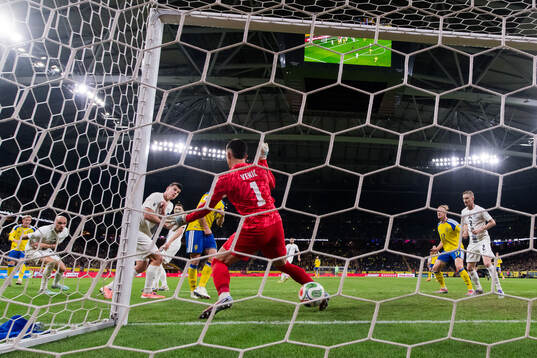 goalkeeper Igor Vekic of Slovenia lets in 1-1 by Gustav