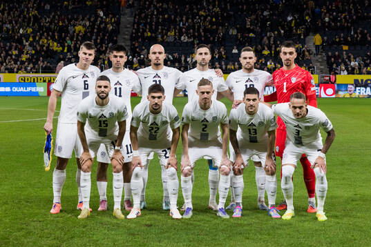 The starting eleven of Slovenia pose for a team photo