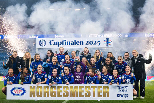 Players of Vålerenga celebrates with the trophy