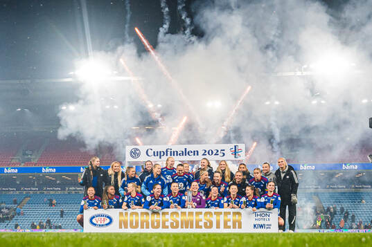 Players of Vålerenga celebrates with the trophy