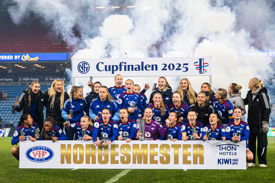 Players of Vålerenga celebrates with the trophy