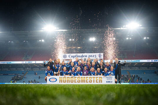 Players of Vålerenga celebrates with the trophy