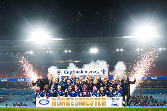 Players of Vålerenga celebrates with the trophy