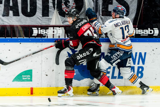 Malmö Redhawks Felix Carell och Växjös Dylan Mclaughlin
