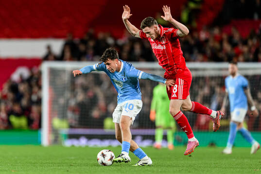Kenan Busuladzic of Malmö FF and Elliot Anderson of