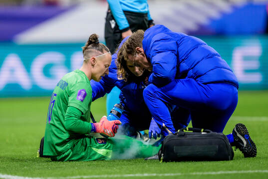 Goalkeeper Pauline Peyraud Magnin of France receives