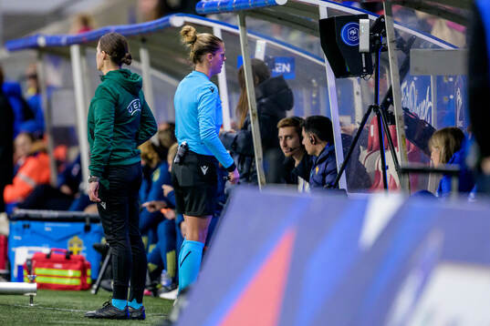 Referee Désirée Blanco looks at the VAR monitor