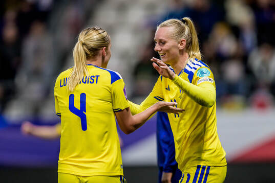 Hanna Lundkvist and Stina Blackstenius of Sweden celebrate