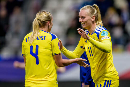 Hanna Lundkvist and Stina Blackstenius of Sweden celebrate
