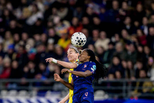 Kosovare Asllani of Sweden and Oriane Jean-Francois of