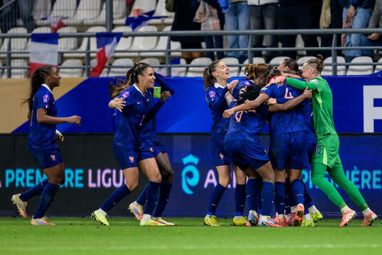Griedge Mbock Bathy of France celebrate with teammates