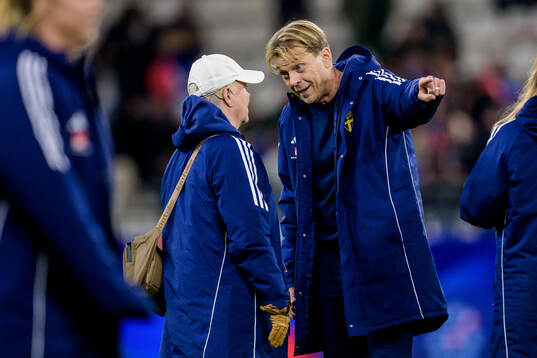Senior Advisor Marika Domanski Lyfors and Head coach Tony
