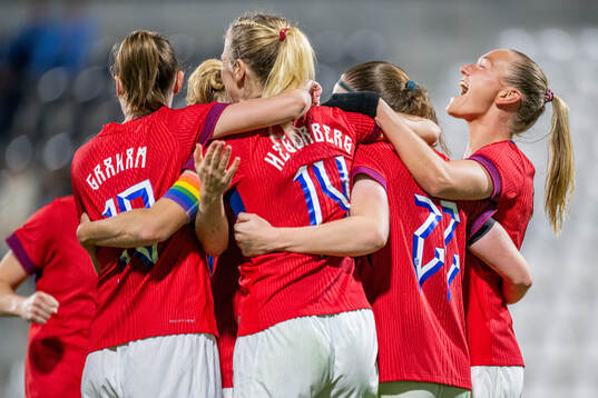 Signe Gaupset of Norway celebrates with teammates Caroline