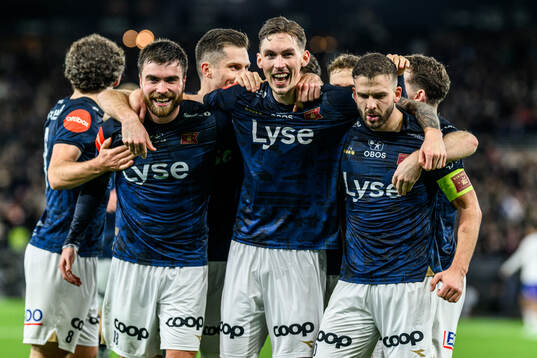 Zlatko Hovland Tripic of Viking celebrate with teammates