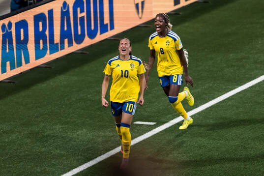 Rosa Kafaji and Evelyn Ijeh of Sweden celebrate