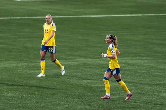 Elma Junttila Nelhage and Kosovare Asllani of Sweden
