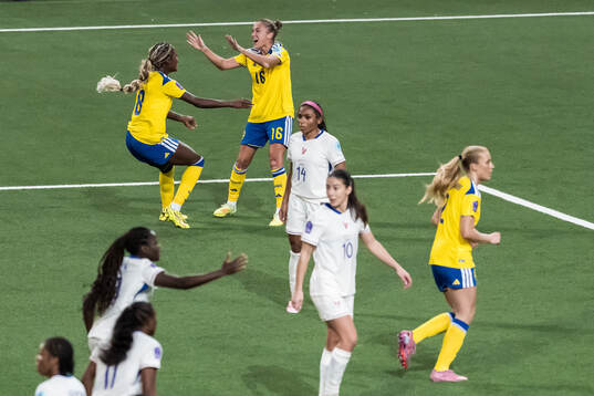Evelyn Ijeh and Filippa Angeldahl of Sweden celebrate