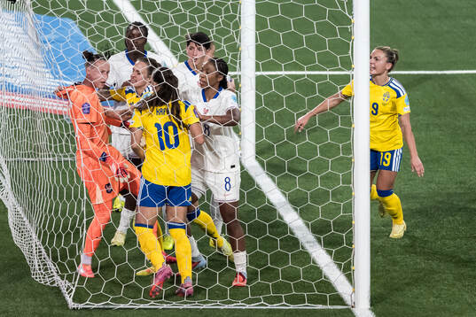 Goalkeeper Pauline Peyraud-Magnin of France argues with