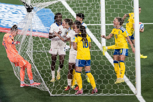 Goalkeeper Pauline Peyraud-Magnin of France argues with