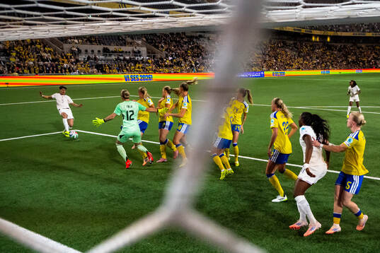 Elisa De Almeida of France challenges goalkeeper Jennifer