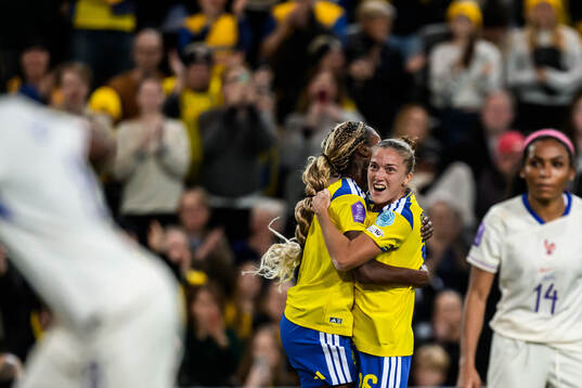 Evelyn Ijeh and Filippa Angeldahl of Sweden celebrate the
