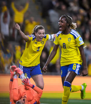 Linda Sembrant and Evelyn Ijeh of Sweden celebrate the 2-1
