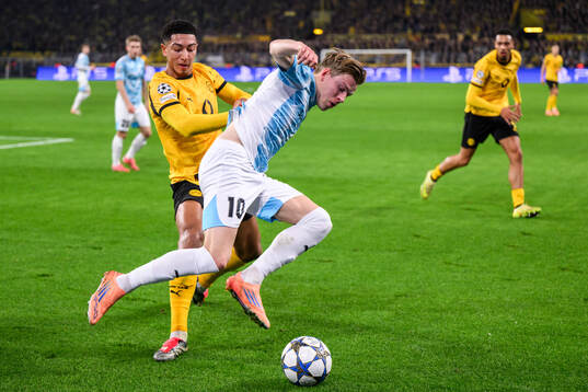 Felix Nmecha of Borussia Dortmund and Jens Petter Hauge of