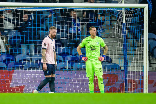 Pontus Jansson and goalkeeper Robin Olsen of Malmö FF look