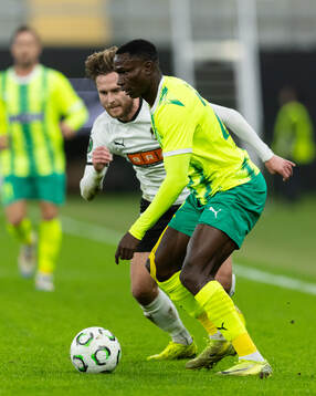 Adam Lundkvist of Häcken and Elohor Godswill of AEK Larnaca