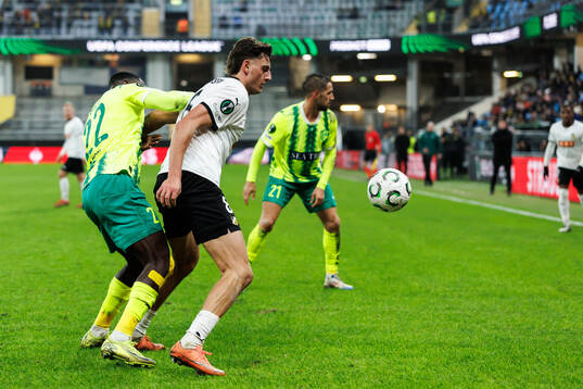 Elohor Godswill of AEK Larnaca and Silas Andersen of Häcken