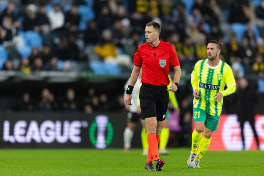 Referee Yigal Frid