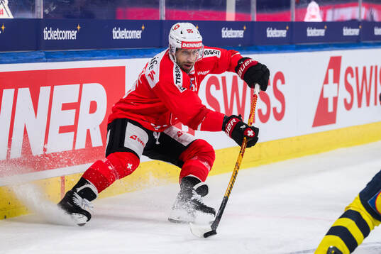 Romain Loeffel  of Switzerland in the ice hockey game