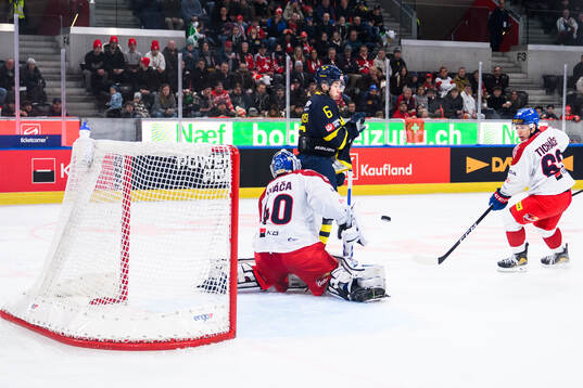Isac Hedqvist of Sweden and Goaltender Petr Kvaca of Czech
