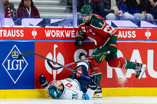 Christian Folin of Frölunda hits Alex Breton of Ingolstadt