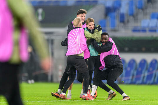 Silas Andersen, Ben Engdahl and Brice Wembangomo celebrate