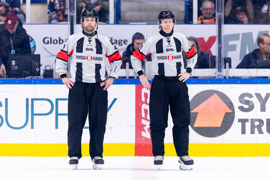 domare Marcus Linde och domare Mikael Holm